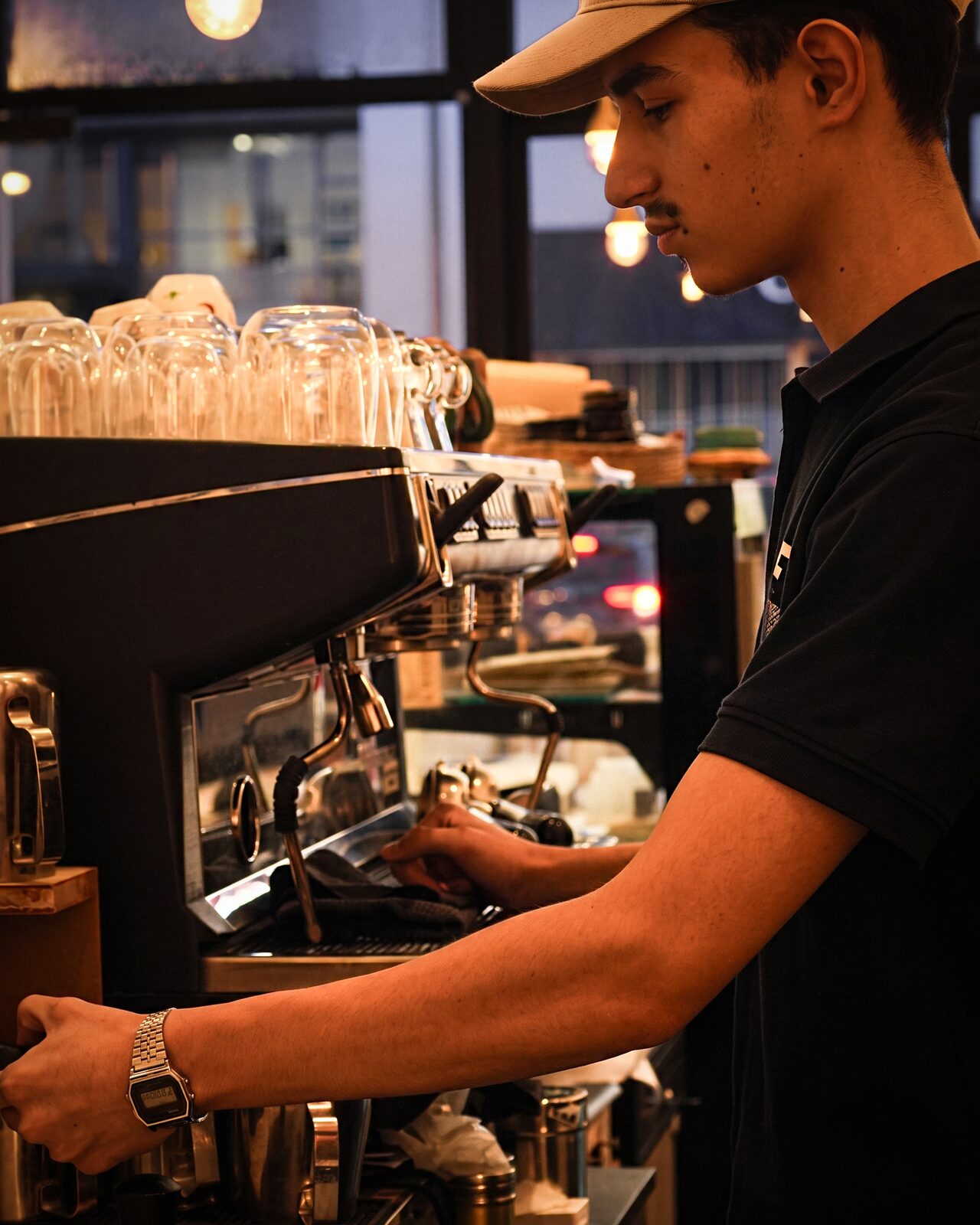 An Adani Corner team member preparing a drink